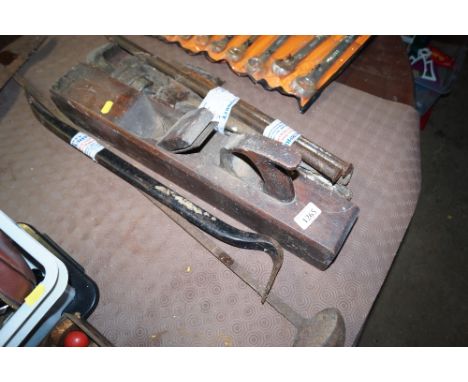 A woodworking plane stamped "D Cohen", a large ladle, wrench, crowbar etc