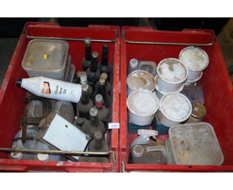 Two boxes containing G-clamps, chainsaw oil etc