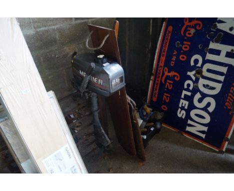 A Mariner outboard engine and two wooden rudders