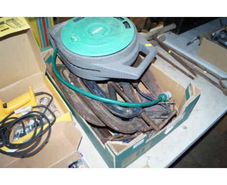A box of various hand tools including G clamps, a Hozelock reel etc