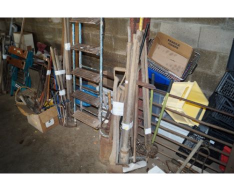 A quantity of long handled garden tools