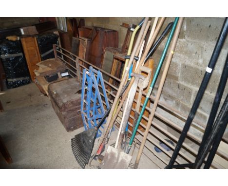 A quantity of long handled garden tools