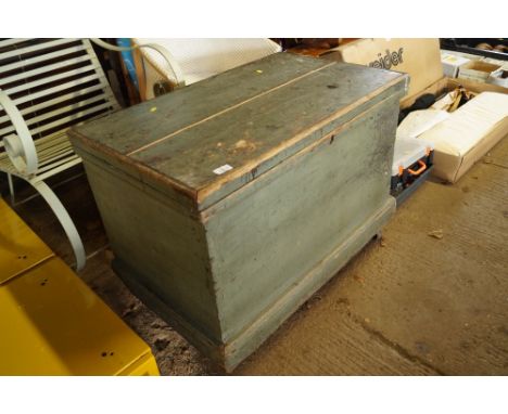A wood trunk fitted with two trays