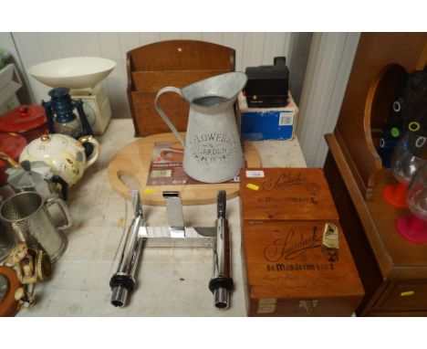 Two wooden cigar boxes; a mixer tap; Polaroid camera; chopping board; flower jug and a letter rack