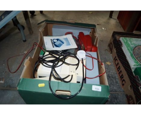 A box containing a projector, accessories and telephone