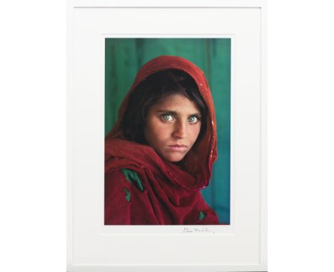 STEVE MCCURRY (AMERICAN b. 1950), SHARBAT GULA, AFGHAN GIRL, PAKISTAN offset lithographic colour print, signed lower right in