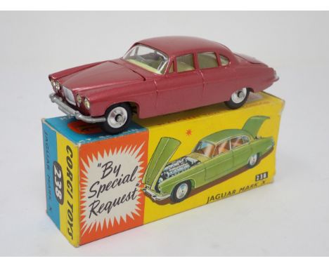 A boxed Corgi Toys No.238 metallic red Jaguar Mark 10 with luggage 