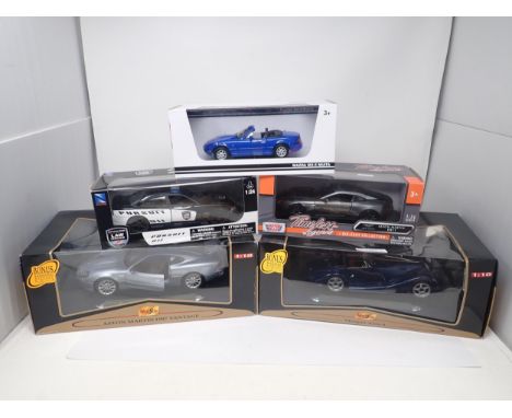 A boxed Maisto 1/18 scale Premiere Edition Morgan Aero and Aston Martin DB7 Vantage, a boxed Mazda MX-5 Miata, a boxed Timele