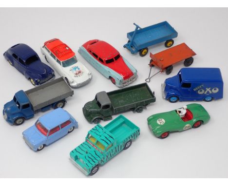 Eleven unboxed Dinky Toys and Corgi Toys including No.110 Aston Martin, Peugeot 203, Trojan 'Oxo' Van, No.30S Austin Planksid
