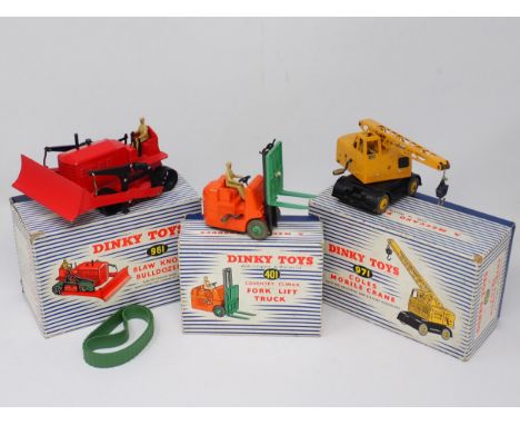 A boxed Dinky Toys No.971 Coles Mobile Crane, a No.961 Blaw-Knox Bulldozer (reproduction tracks) and a No.401 Fork Lift Truck