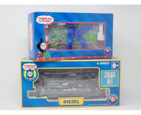 A boxed Lionel 0 gauge Thomas the Tank Engine Series 'Percy' and 'Diesel' Locomotive. Appear unused in excellent to excellent