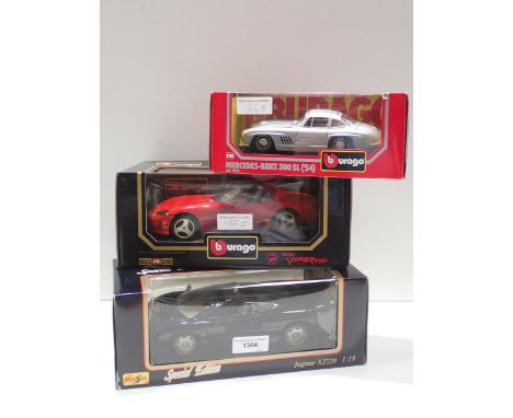 A boxed Burago Mercedes-Benz 300SL, a boxed Burago Dodge Viper RT10 and a boxed Maisto Special Edition Jaguar XJ220 