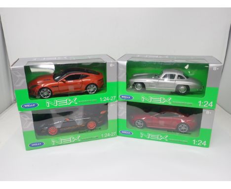 Four boxed Nex Models 1:24 and 1:24-27 scale Models including Aston Martin Vantage, Mercedes-Benz 300SL, Jaguar F-type Coupe 