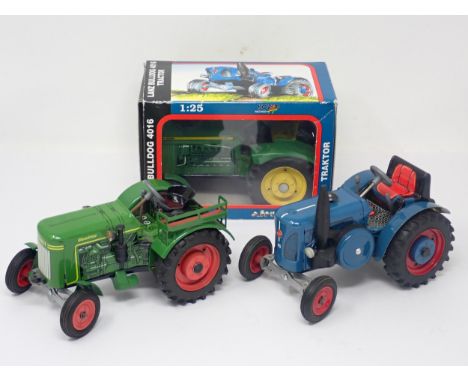 A boxed Lanz Bulldog 4016 Tractor, an unboxed Lanz Bulldog Tractor and an unboxed Fendt Dieselross Tractor 