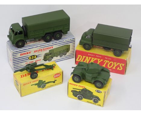 A boxed Dinky Toys No.621 3 Ton Army Wagon, a boxed No.670 Armoured Car, a boxed No.686 25pdr Gun with plastic hubs and a box