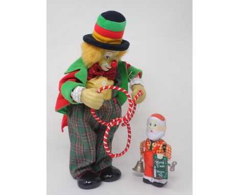 A modern Automaton clockwork musical Clown and a Father Christmas 