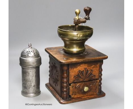   An 18th century oak and brass coffee grinder and a pewter muffineer