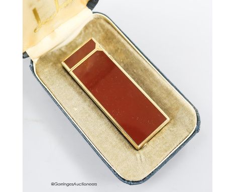   A boxed red Dunhill lighter and a silver plated tobacco caddy