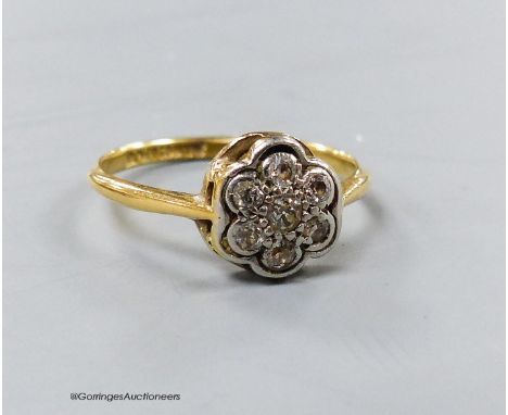   A 1920's 18ct &amp; plat set circular diamond cluster ring, size M/N, gross 1.9 grams.