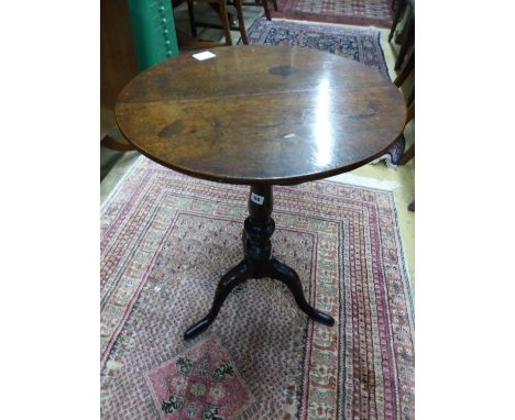   A George III circular oak tripod wine table, Diam.50cm H.71cm