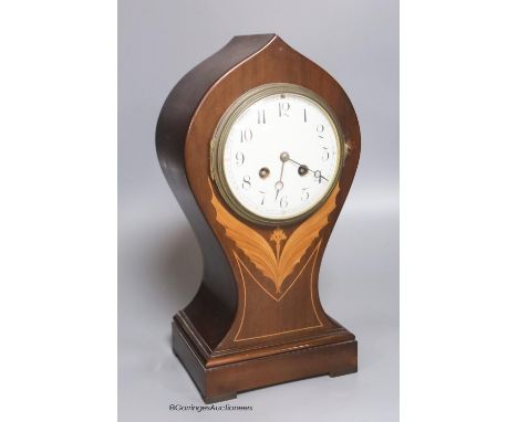   An Edwardian mahogany inlaid balloon mantel clock, height 35cm