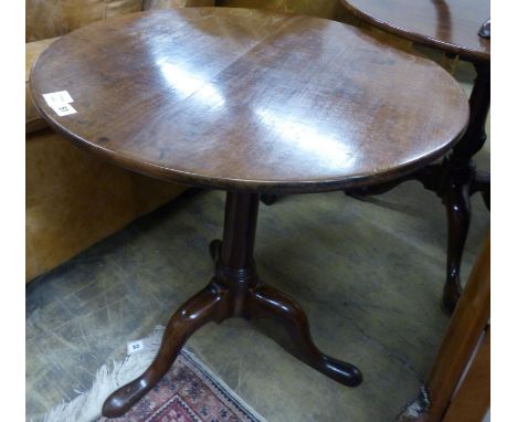   A George III circular mahogany tilt top tripod tea table, Diam.71cm H.70cm