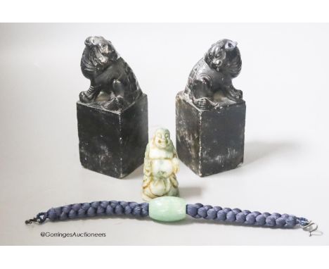   A pair of hardstone carved Temple dogs, height 13cm, a Buddha and a jade bead bracelet