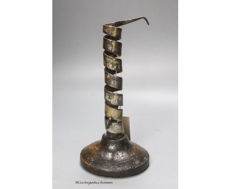   A late 17th century adjustable oak sheet-iron candlestick, height 20.5cm