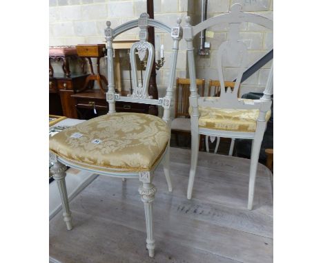   A set of four French light green painted salon chairs