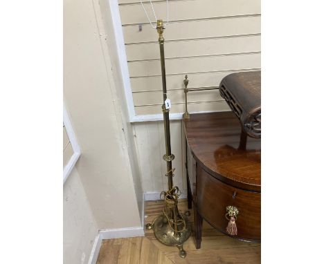   An Arts and Crafts brass telescopic standard lamp.