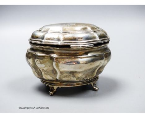   An Edwardian silver shaped oval tea caddy, Charles Stuart Harris Ltd, London, 1902, length 13.4cm, 7.5oz.