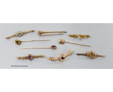   Four assorted early 20th century 9ct  and gem set bar brooches, gross 9.1 grams, two yellow metal bar brooches including hu