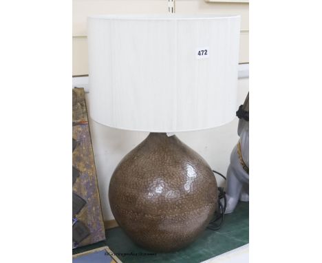   A contemporary hammered metal table lamp, overall height 57cm