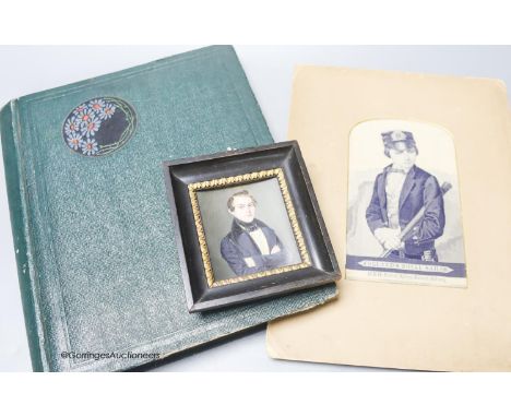   A Stevenograph type portrait album of Royals postcards and a Victorian portrait miniature
