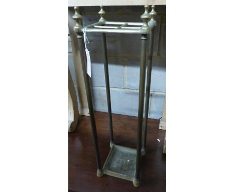   A tubular brass four division stick stand, H.66cm