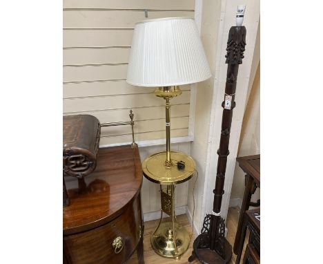   An early 20th century hammered brass standard lamp.