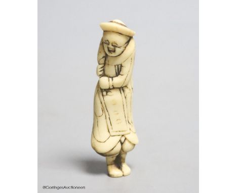   An 18th century Japanese stag antler netsuke of a Dutchman, 7cm