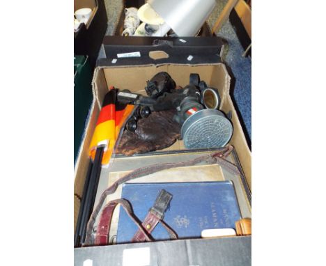 A box of assorted militaria to include pictures, compass, microphone, WWII gas mask etc