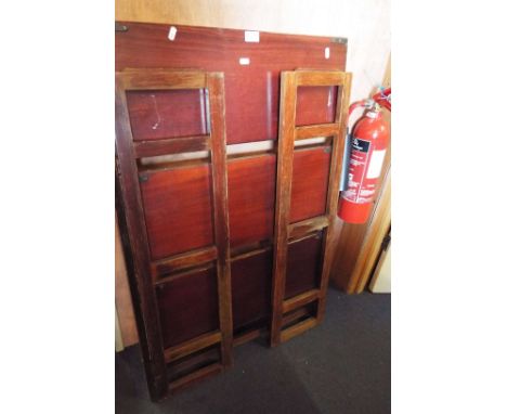 A folding three-shelf bookcase