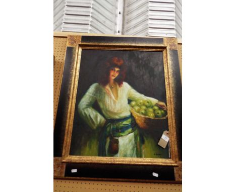 A mid-20thC oil on canvas portrait of a lady carrying a basket of apples, signed to lower left and framed