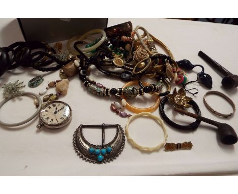 A box of assorted costume jewellery to include silver bangle, beaded necklace, pocket watch etc