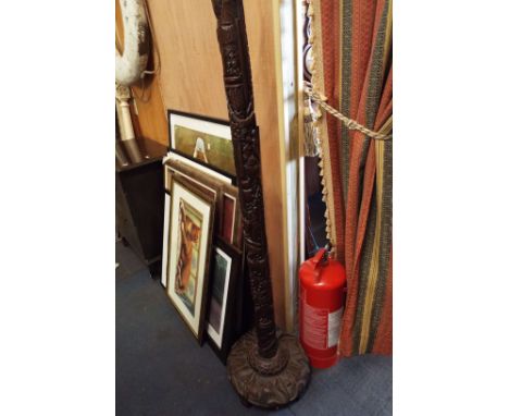 A Chinese carved hardwood lamp stand