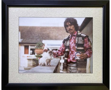 A mounted, framed and glazed vintage cibachrome print of an image by Robert Whitaker depicting George Harrison (and cat) at E