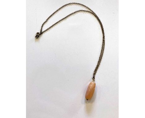 A gemstone on a gold metal chain, with signed certificate of authenticity stating that this example was owned and worn by Jim