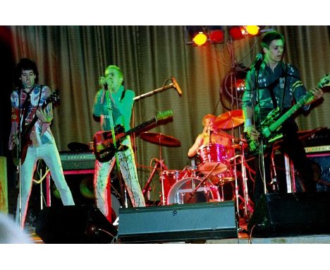 A set of 22 original photo negatives, depicting the Sex Pistols and support acts The Clash and Johnny Thunders on stage, as w