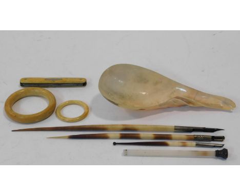 A collection of miscellaneous items. Including an antique ivory multi penknife, two antique ivory rings, a conch shell spoon,