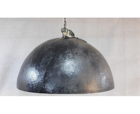A very large contemporary domed black fibreglass ceiling light with textured and gilded interior. Light fitting has five adju