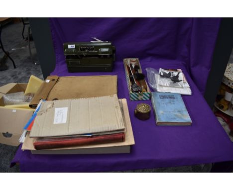 A WW2 British Kharki Map Case, a Military Field Telephone Set L MK1, a piece of brass Royal Artillery Trench Art and Gun Clea