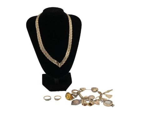 Yellow metal charm bracelet, set with various charms, with 22ct gold wedding band, others marked 9ct, along with plated examp