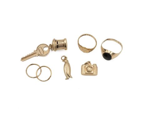 Collection of 9ct gold and yellow metal jewellery, including a signet ring, charms and other items, all tested as 9ct. 8.88 g